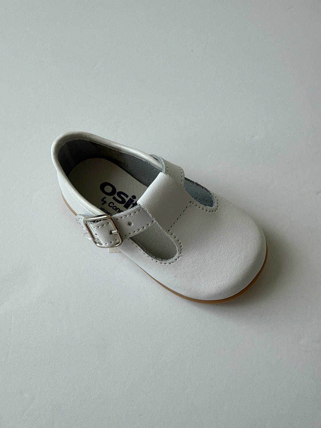 White leather t-strap shoe