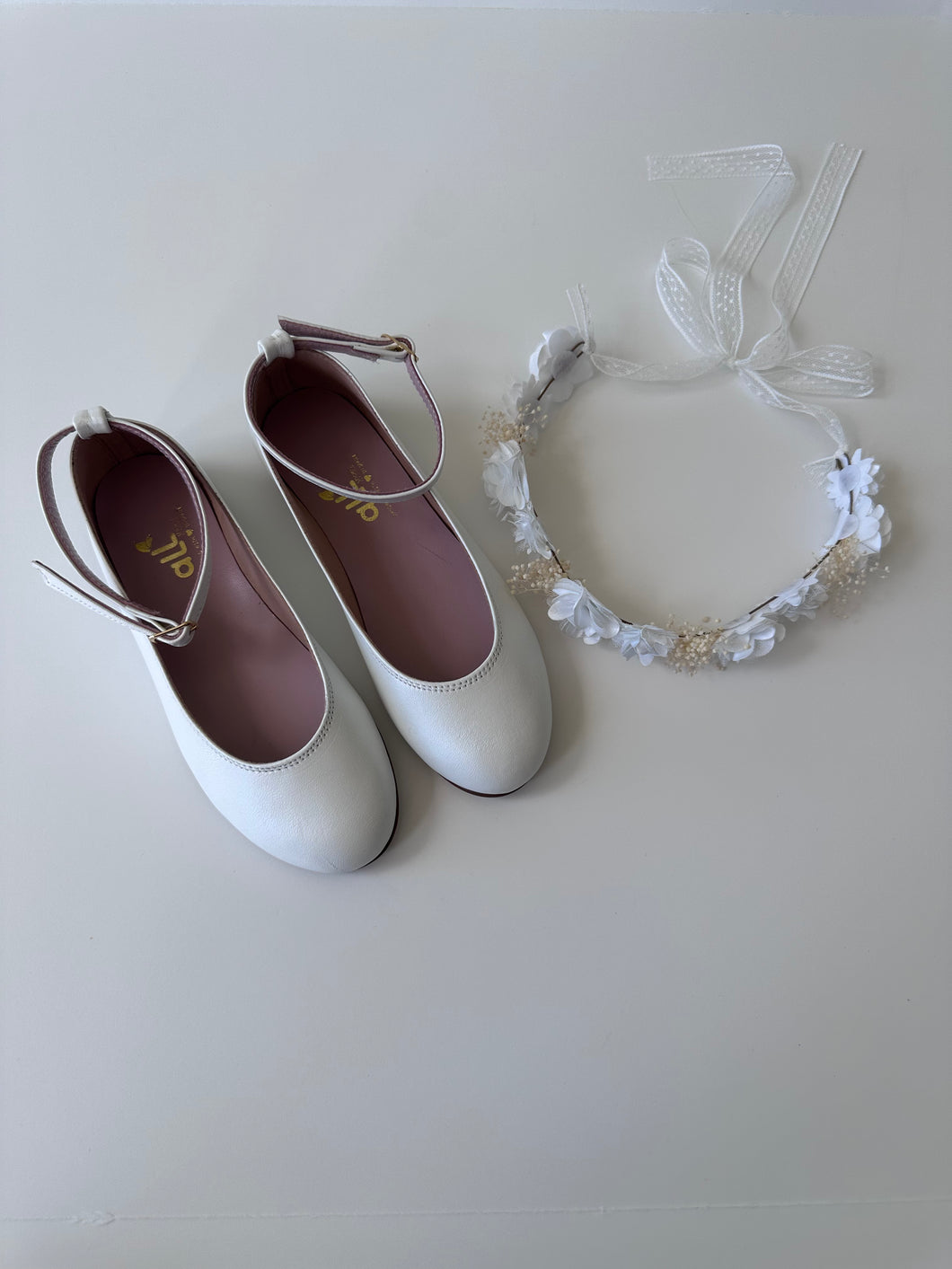 White leather ballerinas with ankle strap