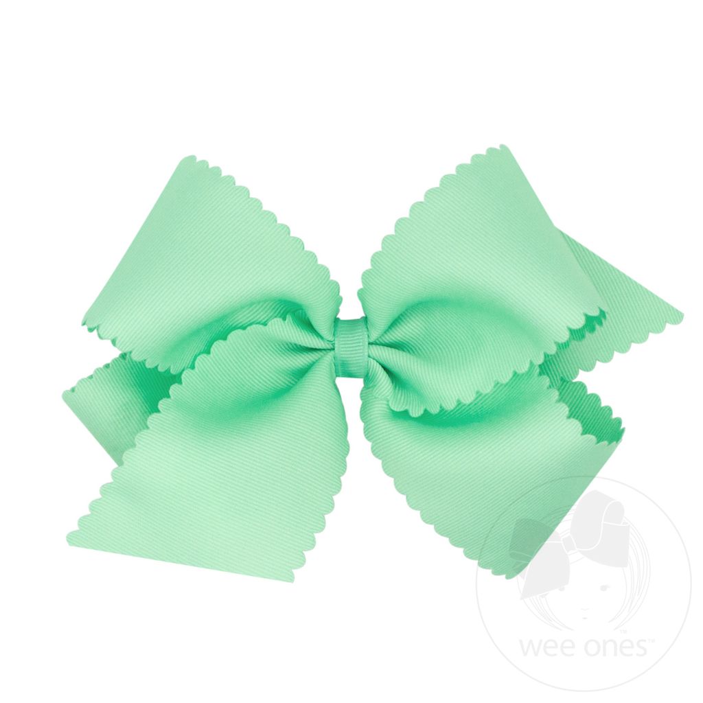Pale green scalloped edge grosgrain bow