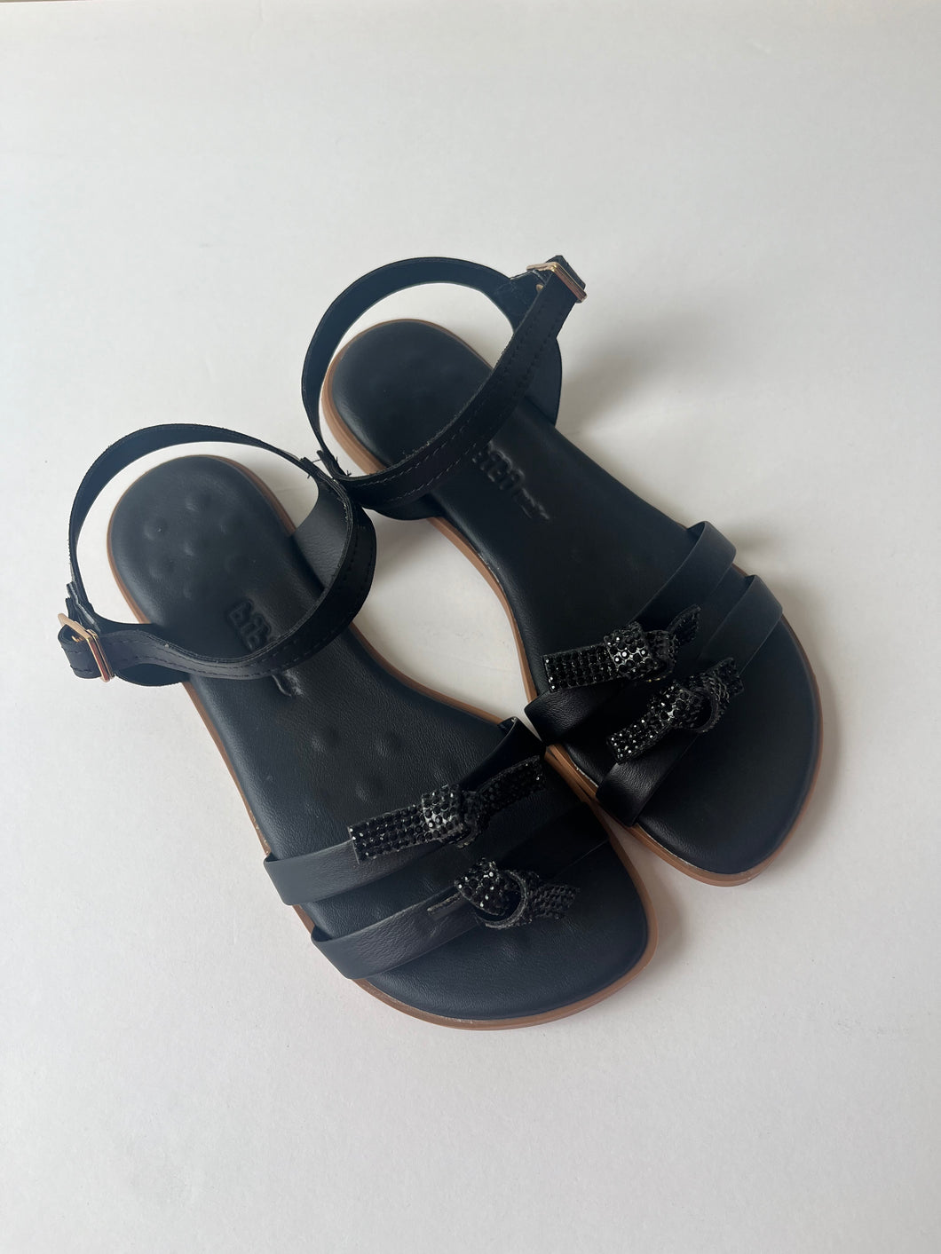 Black leather sandal with rhinestone bows