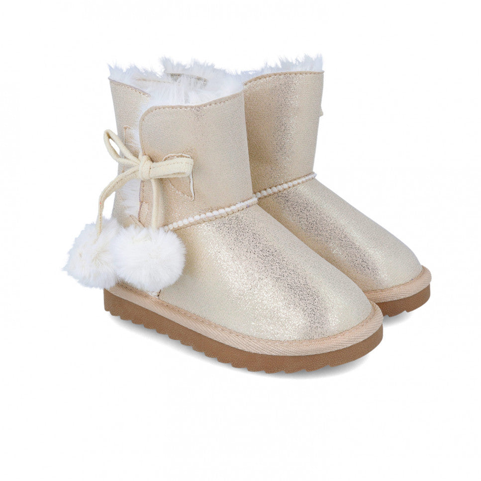 Gold metallic boots with pompoms