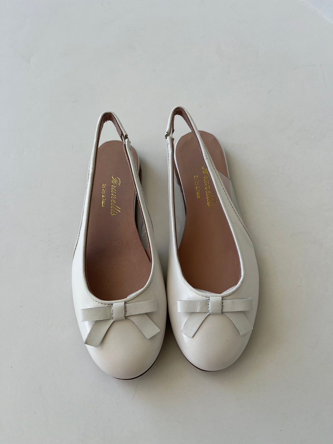 White leather sling back with front bow