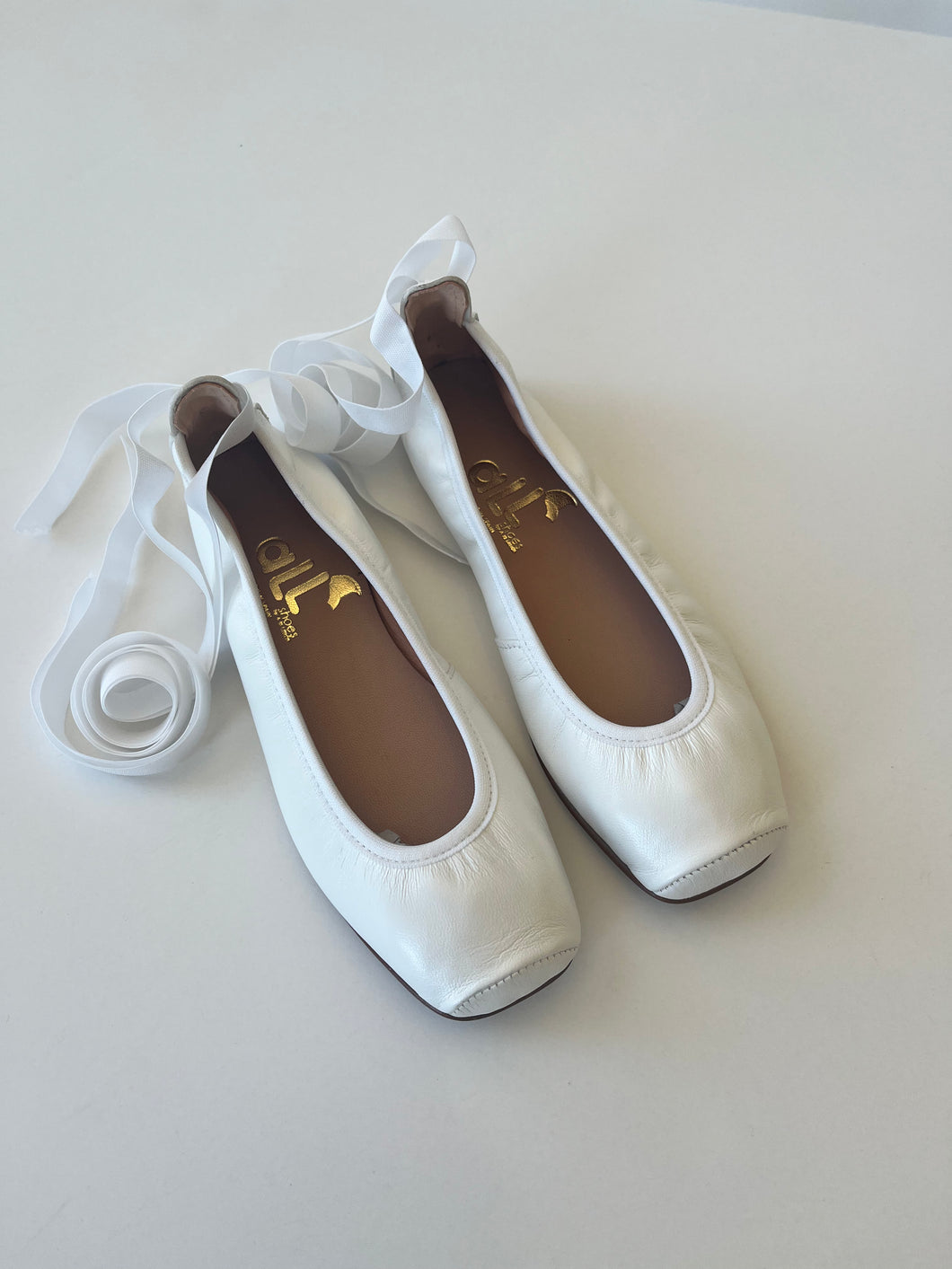 White ballerina with ankle tie up ribbon