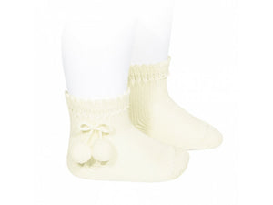 Beige short socks with pompoms