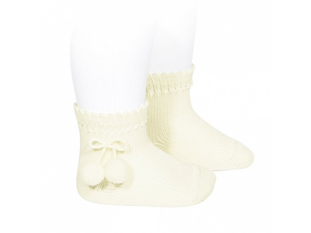 Beige short socks with pompoms