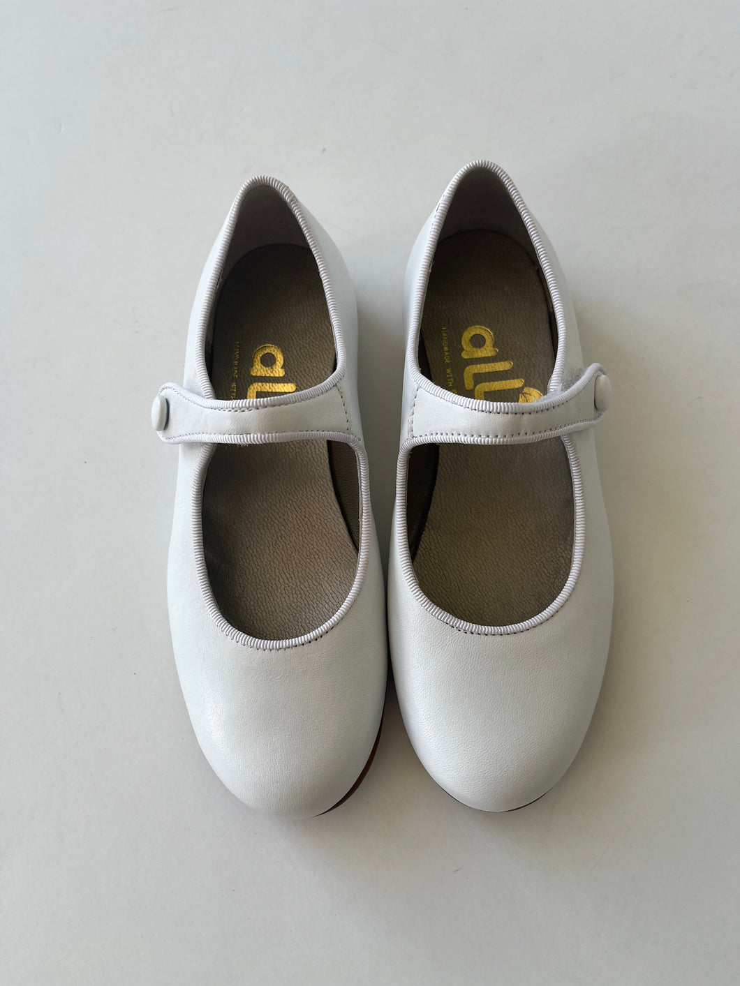 Classic white leather mary jane with button